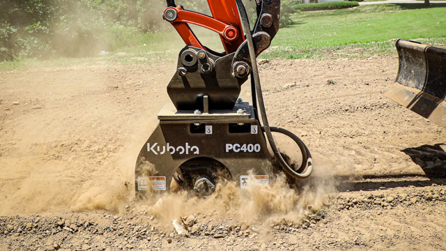 Vibratory plate compactor store for mini excavator