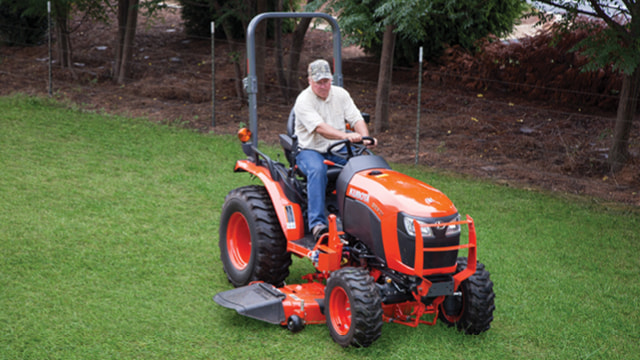 Drive-over mid-mount mower